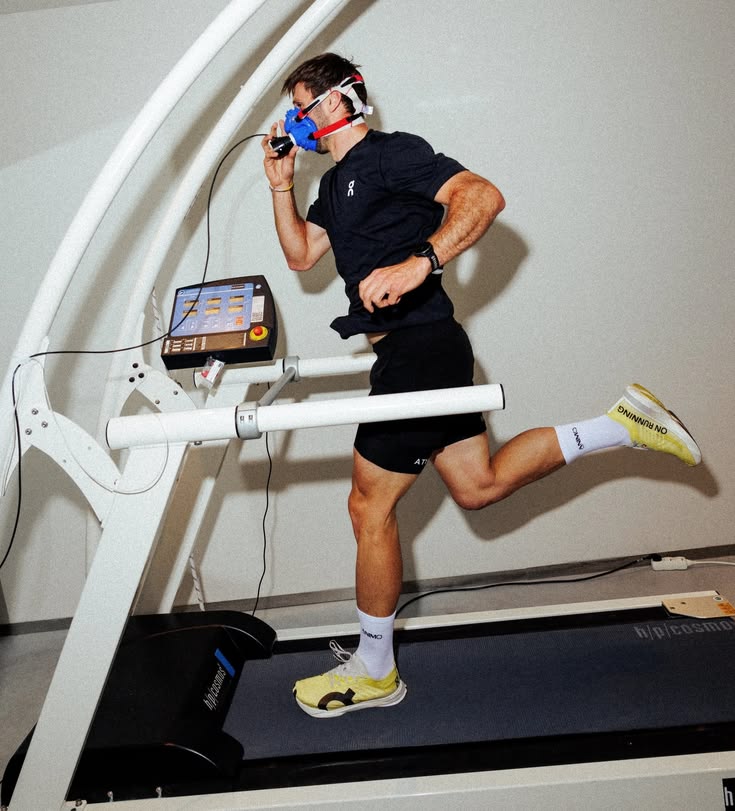 Athlete on treadmill wearing a metabolic mask
